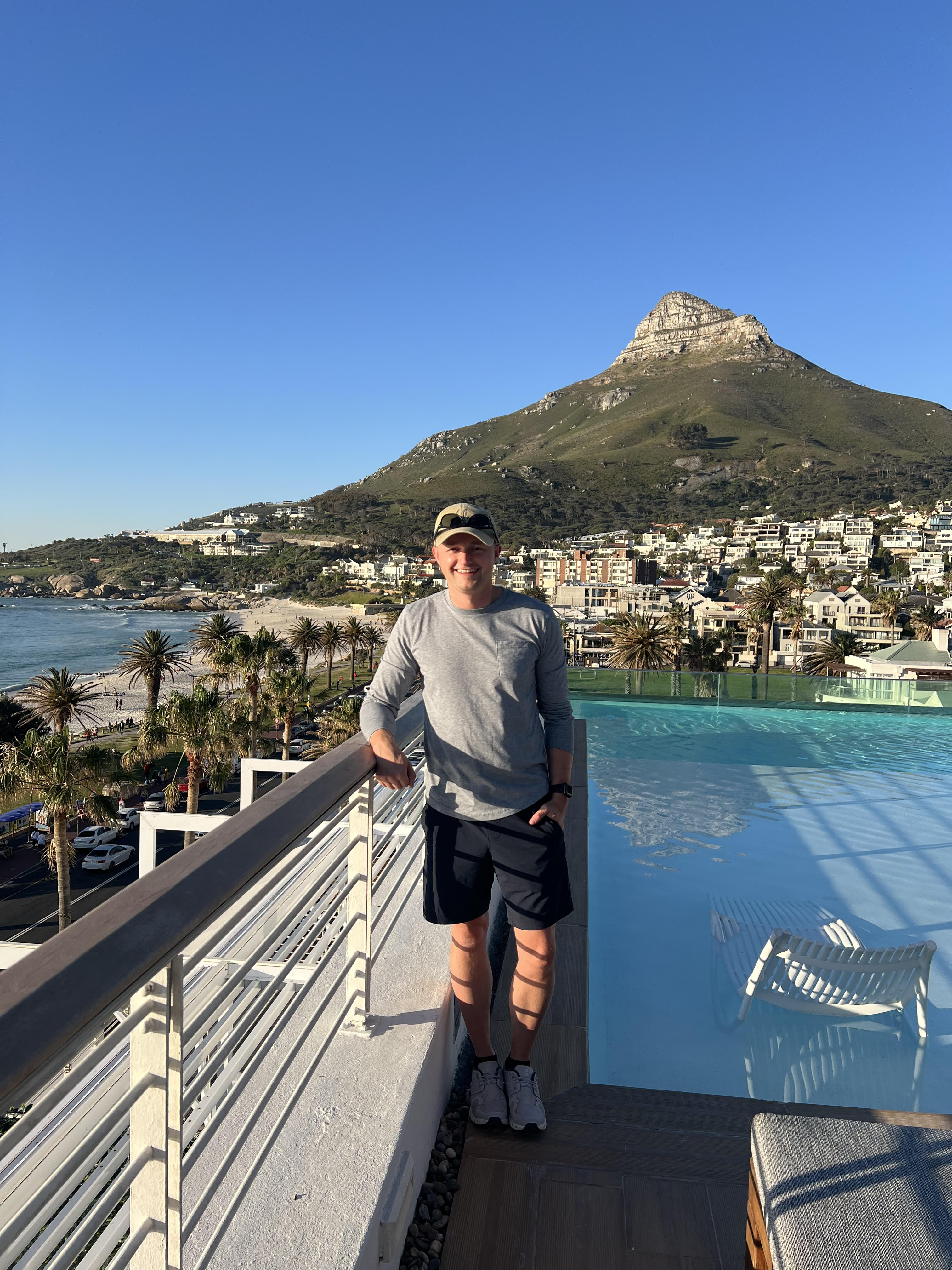Nick at Camps Bay rooftop with Lion's Head behind him — Cape Town, South Africa